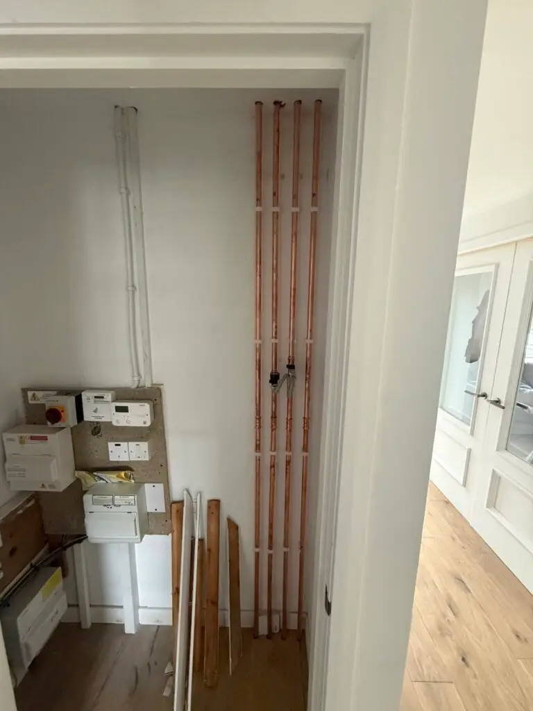 New heating pipework and electrics in a cupboard